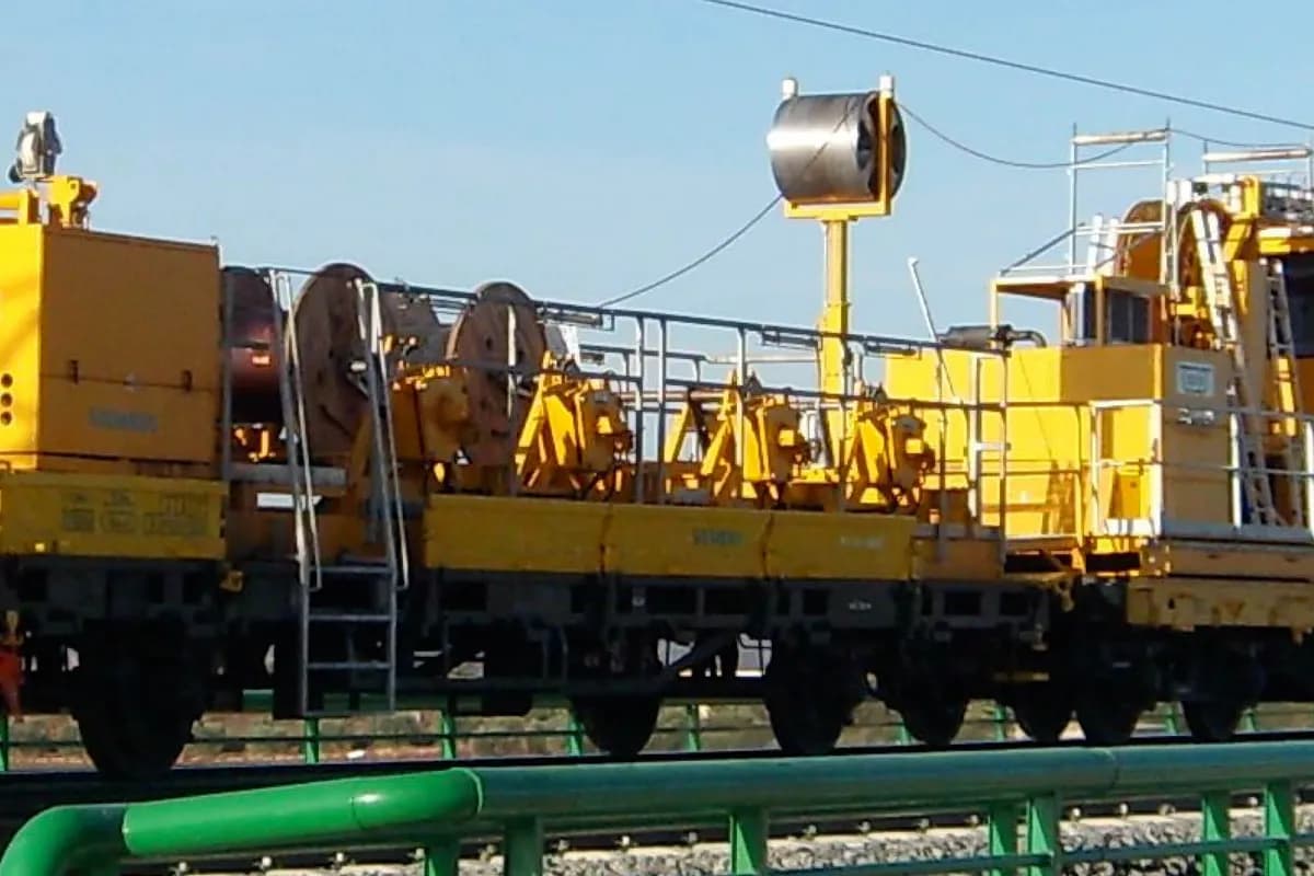ZECK road-rail vehicles and catenary construction machinery on a railway